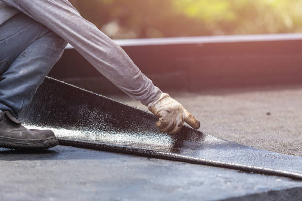 Professional Basement Waterproofing technician working in Winchester, IL